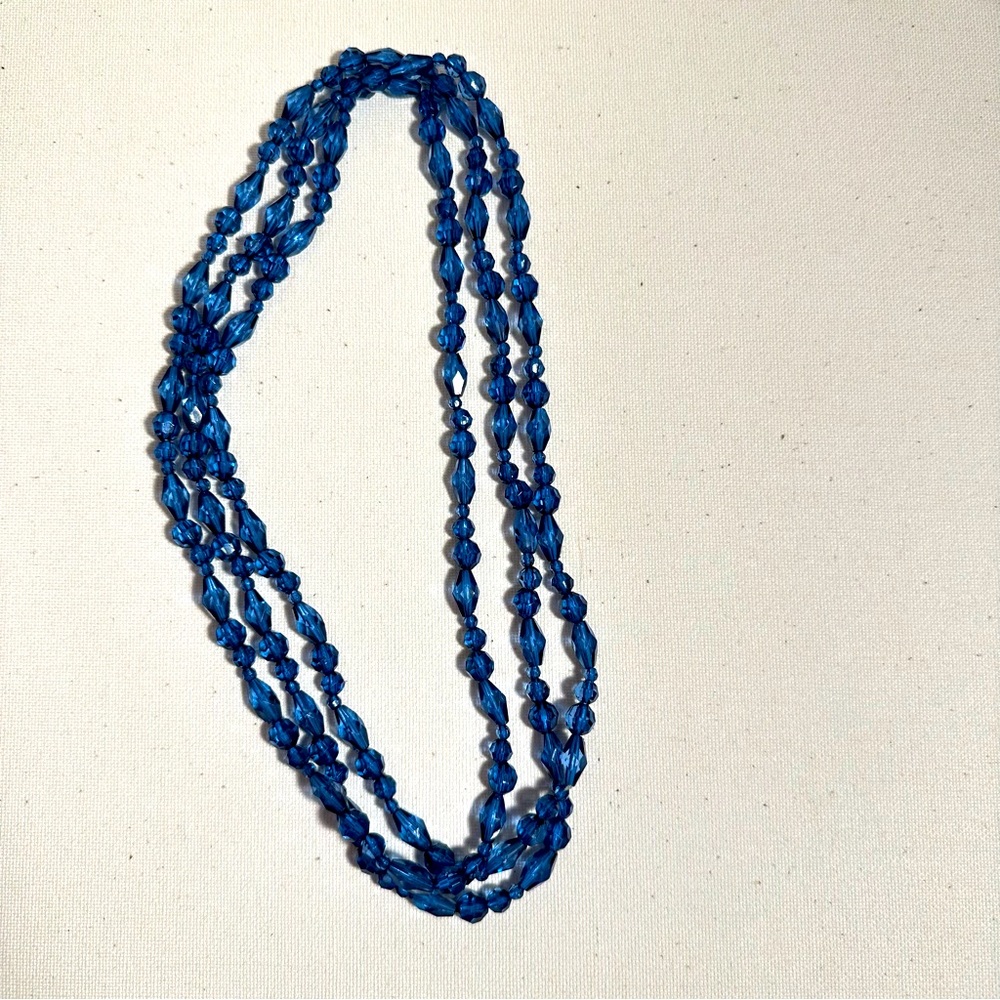 long blue beaded necklace